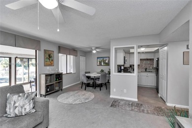 55+ COMMUNITY. GORGEOUS, TWO-BEDROOM/1.5 BATHS, SECOND-FLOOR END on Rolling Greens Executive Golf Community in Florida - for sale on GolfHomes.com, golf home, golf lot