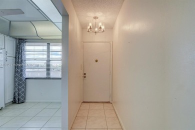 Great unit on top floor, views of garden and pool from your on Wynmoor Golf Course in Florida - for sale on GolfHomes.com, golf home, golf lot