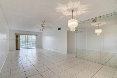 Great unit on top floor, views of garden and pool from your on Wynmoor Golf Course in Florida - for sale on GolfHomes.com, golf home, golf lot