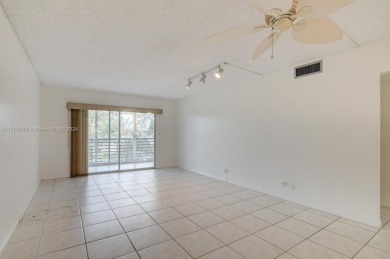 Great unit on top floor, views of garden and pool from your on Wynmoor Golf Course in Florida - for sale on GolfHomes.com, golf home, golf lot