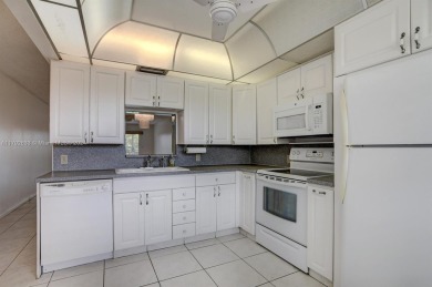 Great unit on top floor, views of garden and pool from your on Wynmoor Golf Course in Florida - for sale on GolfHomes.com, golf home, golf lot