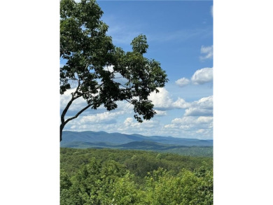 Nestled within the heart of Big Canoe's stunning mountain on Big Canoe Golf Club - Cherokee in Georgia - for sale on GolfHomes.com, golf home, golf lot