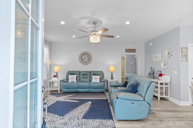 This charming 2-bedroom, 2-bath beach bungalow is one you'll on Barefoot Resort and Golf Club  in South Carolina - for sale on GolfHomes.com, golf home, golf lot