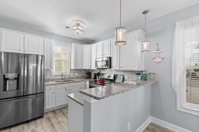 This charming 2-bedroom, 2-bath beach bungalow is one you'll on Barefoot Resort and Golf Club  in South Carolina - for sale on GolfHomes.com, golf home, golf lot