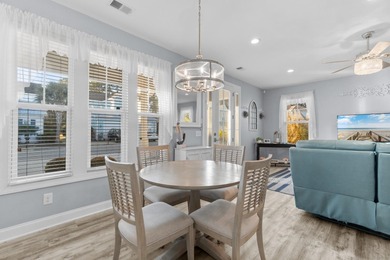 This charming 2-bedroom, 2-bath beach bungalow is one you'll on Barefoot Resort and Golf Club  in South Carolina - for sale on GolfHomes.com, golf home, golf lot