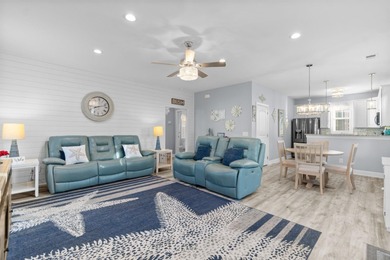 This charming 2-bedroom, 2-bath beach bungalow is one you'll on Barefoot Resort and Golf Club  in South Carolina - for sale on GolfHomes.com, golf home, golf lot