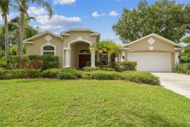 Location, Location - Tampa Palms beauty. This 4/3/2 plus a den on Tampa Palms Golf and Country Club in Florida - for sale on GolfHomes.com, golf home, golf lot