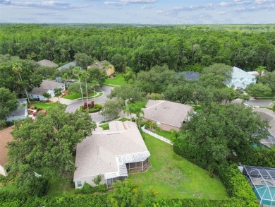 Location, Location - Tampa Palms beauty. This 4/3/2 plus a den on Tampa Palms Golf and Country Club in Florida - for sale on GolfHomes.com, golf home, golf lot