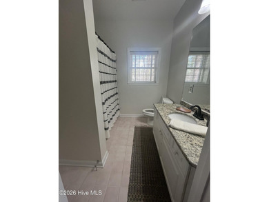 Welcome to your charming all-brick ranch, perfectly situated on on Woodlake Country Club in North Carolina - for sale on GolfHomes.com, golf home, golf lot