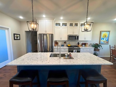 A rare opportunity to own a 2024 custom home overlooking the #12 on Cherokee Village South Course in Arkansas - for sale on GolfHomes.com, golf home, golf lot