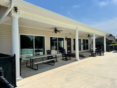 Live the low-maintenance lifestyle in the popular Gwinnett B on Players Course At Wyboo Plantation in South Carolina - for sale on GolfHomes.com, golf home, golf lot