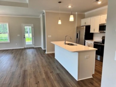 Live the low-maintenance lifestyle in the popular Gwinnett B on Players Course At Wyboo Plantation in South Carolina - for sale on GolfHomes.com, golf home, golf lot
