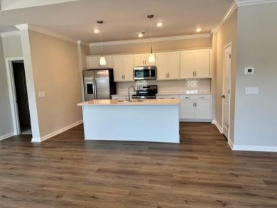 Live the low-maintenance lifestyle in the popular Gwinnett B on Players Course At Wyboo Plantation in South Carolina - for sale on GolfHomes.com, golf home, golf lot
