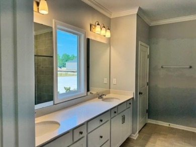 Live the low-maintenance lifestyle in the popular Gwinnett B on Players Course At Wyboo Plantation in South Carolina - for sale on GolfHomes.com, golf home, golf lot