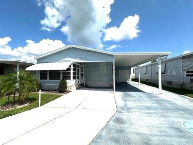 LOVELY WELL MAINTAINED 2 BEDROOM 2 BATH MANUFACTURED HOME on Lily Lake Golf and RV Resort in Florida - for sale on GolfHomes.com, golf home, golf lot