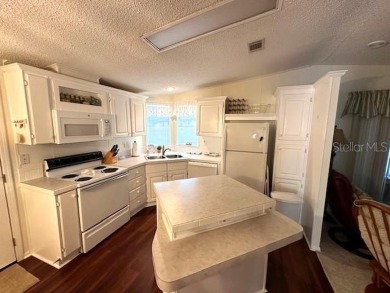 LOVELY WELL MAINTAINED 2 BEDROOM 2 BATH MANUFACTURED HOME on Lily Lake Golf and RV Resort in Florida - for sale on GolfHomes.com, golf home, golf lot