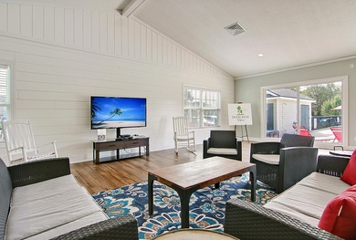 Live the low-maintenance lifestyle in the popular Gwinnett B on Players Course At Wyboo Plantation in South Carolina - for sale on GolfHomes.com, golf home, golf lot