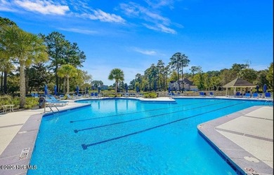 Discover the Skiff, a beautiful new Logan Home, located in on Sea Trail Golf Resort in North Carolina - for sale on GolfHomes.com, golf home, golf lot