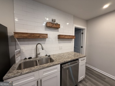 Discover modern comfort in this beautifully renovated home on John A. White Golf Course in Georgia - for sale on GolfHomes.com, golf home, golf lot