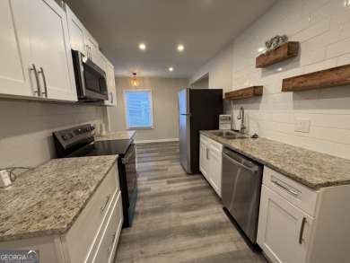 Discover modern comfort in this beautifully renovated home on John A. White Golf Course in Georgia - for sale on GolfHomes.com, golf home, golf lot