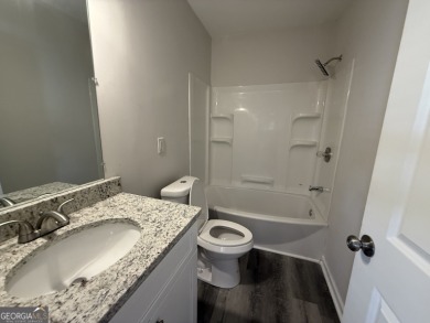 Discover modern comfort in this beautifully renovated home on John A. White Golf Course in Georgia - for sale on GolfHomes.com, golf home, golf lot