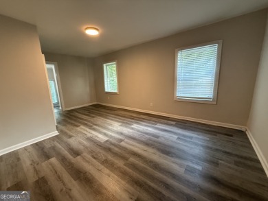 Discover modern comfort in this beautifully renovated home on John A. White Golf Course in Georgia - for sale on GolfHomes.com, golf home, golf lot