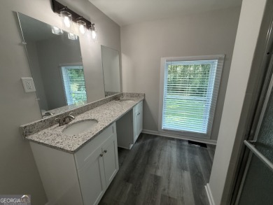 Discover modern comfort in this beautifully renovated home on John A. White Golf Course in Georgia - for sale on GolfHomes.com, golf home, golf lot