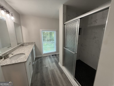 Discover modern comfort in this beautifully renovated home on John A. White Golf Course in Georgia - for sale on GolfHomes.com, golf home, golf lot