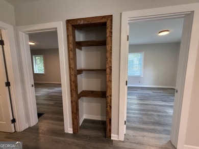 Discover modern comfort in this beautifully renovated home on John A. White Golf Course in Georgia - for sale on GolfHomes.com, golf home, golf lot