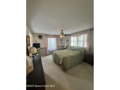 Welcome to the vibrant Barefoot Bay community! This 2-bedroom on Barefoot Bay Golf Course in Florida - for sale on GolfHomes.com, golf home, golf lot