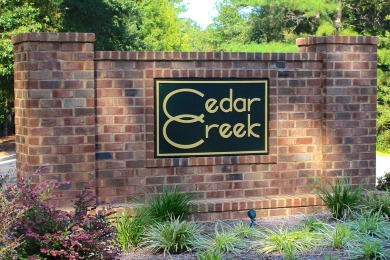 Lovely, well-treed home site with a front to back topography in on The Golf Club At Cedar Creek in South Carolina - for sale on GolfHomes.com, golf home, golf lot