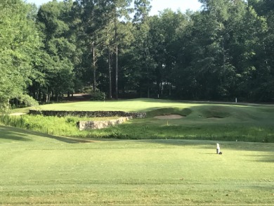 Lovely, well-treed home site with a front to back topography in on The Golf Club At Cedar Creek in South Carolina - for sale on GolfHomes.com, golf home, golf lot