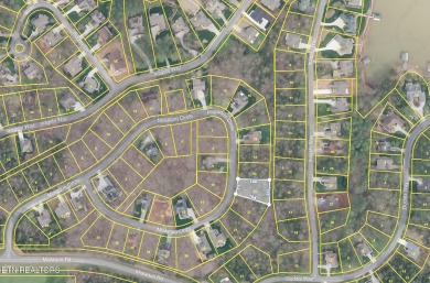 Located at 242 Mialaquo Circle, this vacant lot in Tellico on Tellico Village Golf Club in Tennessee - for sale on GolfHomes.com, golf home, golf lot
