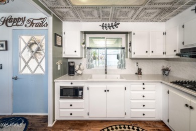 This charming and well-maintained, recently updated 2-bedroom on Fountain of the Sun Country Club in Arizona - for sale on GolfHomes.com, golf home, golf lot