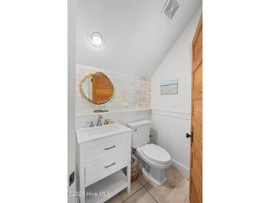 Located on a high homesite overlooking the 13th tee of the Bald on Bald Head Island Golf Club in North Carolina - for sale on GolfHomes.com, golf home, golf lot