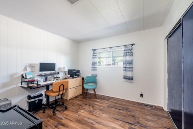 This charming and well-maintained, recently updated 2-bedroom on Fountain of the Sun Country Club in Arizona - for sale on GolfHomes.com, golf home, golf lot