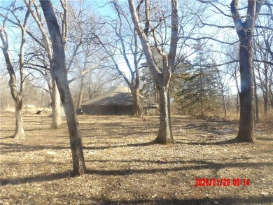 Enjoy this weekend/vacation retreat nestled in the trees on 1 on Sugar Valley Lakes Golf Course in Kansas - for sale on GolfHomes.com, golf home, golf lot