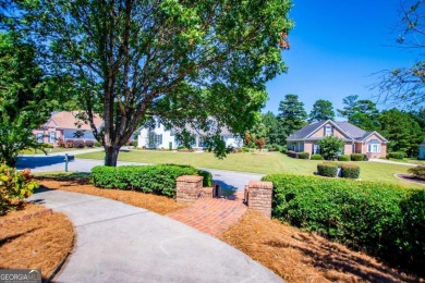 Welcome to this amazing home filled with southern charm nestled on Mirror Lake Golf Club in Georgia - for sale on GolfHomes.com, golf home, golf lot