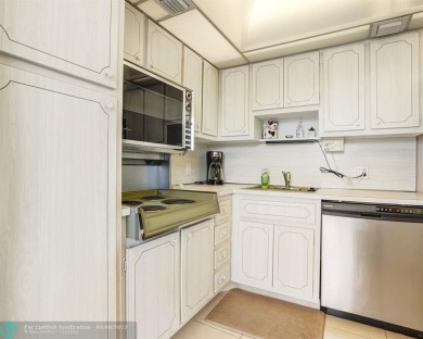 Discover your dream home in Palm Aire Country Club! This on Palm-Aire Country Club and Resort - Palms in Florida - for sale on GolfHomes.com, golf home, golf lot