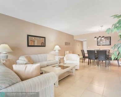 Discover your dream home in Palm Aire Country Club! This on Palm-Aire Country Club and Resort - Palms in Florida - for sale on GolfHomes.com, golf home, golf lot