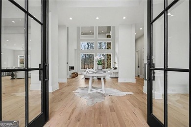 Set on a private 2.3-acre creek-lined homesite in the on Echelon Golf Club in Georgia - for sale on GolfHomes.com, golf home, golf lot