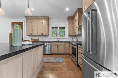 Nestled within the private, gated confines of Chinquapin, a 2 on Natures Walk At Chinquapin in North Carolina - for sale on GolfHomes.com, golf home, golf lot