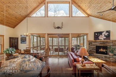 Step inside and feel the warmth of this beautifully crafted on Sapphire National Golf Club in North Carolina - for sale on GolfHomes.com, golf home, golf lot