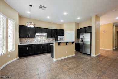 Live a Luxury Lifestyle in Tudor Park at Queensridge. Step into on Badlands Golf Club in Nevada - for sale on GolfHomes.com, golf home, golf lot