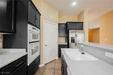 Live a Luxury Lifestyle in Tudor Park at Queensridge. Step into on Badlands Golf Club in Nevada - for sale on GolfHomes.com, golf home, golf lot