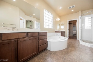 Live a Luxury Lifestyle in Tudor Park at Queensridge. Step into on Badlands Golf Club in Nevada - for sale on GolfHomes.com, golf home, golf lot