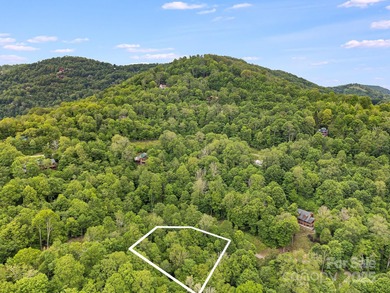 Experience authentic high-elevation mountain living on this on Wolf Laurel Country Club in North Carolina - for sale on GolfHomes.com, golf home, golf lot