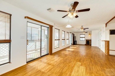 CHARMING THREE-BEDROOM CANAL HOME IN JAMAICA BEACH has a on Galveston Country Club in Texas - for sale on GolfHomes.com, golf home, golf lot