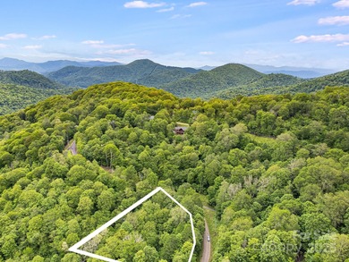 Experience authentic high-elevation mountain living on this on Wolf Laurel Country Club in North Carolina - for sale on GolfHomes.com, golf home, golf lot