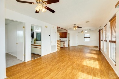 CHARMING THREE-BEDROOM CANAL HOME IN JAMAICA BEACH has a on Galveston Country Club in Texas - for sale on GolfHomes.com, golf home, golf lot